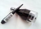 The brush pops out of the cap
